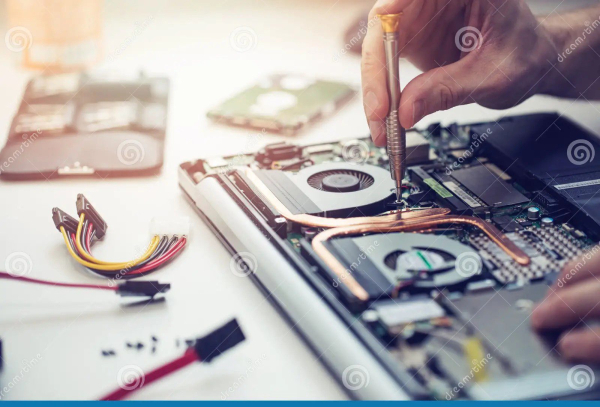 Technician repairing a laptop